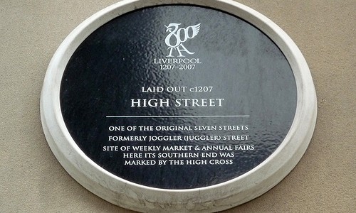 Black plaque marking the location of High Street, Liverpool, one of the original seven streets of the town